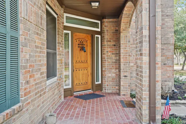 a view of a brick house with an outdoor space