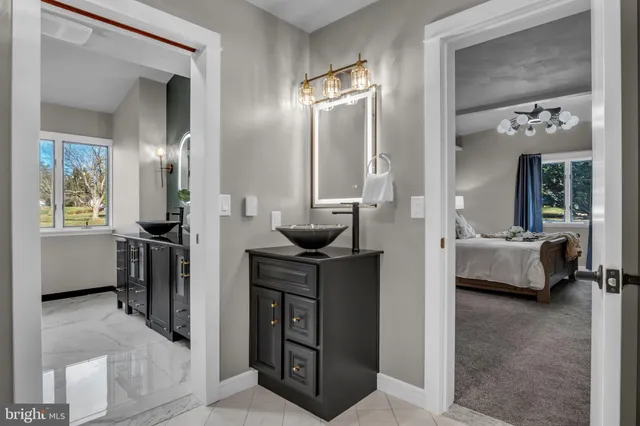 a bathroom with a sink and a mirror