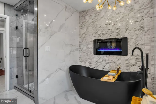 a living room with couches and a flat screen tv