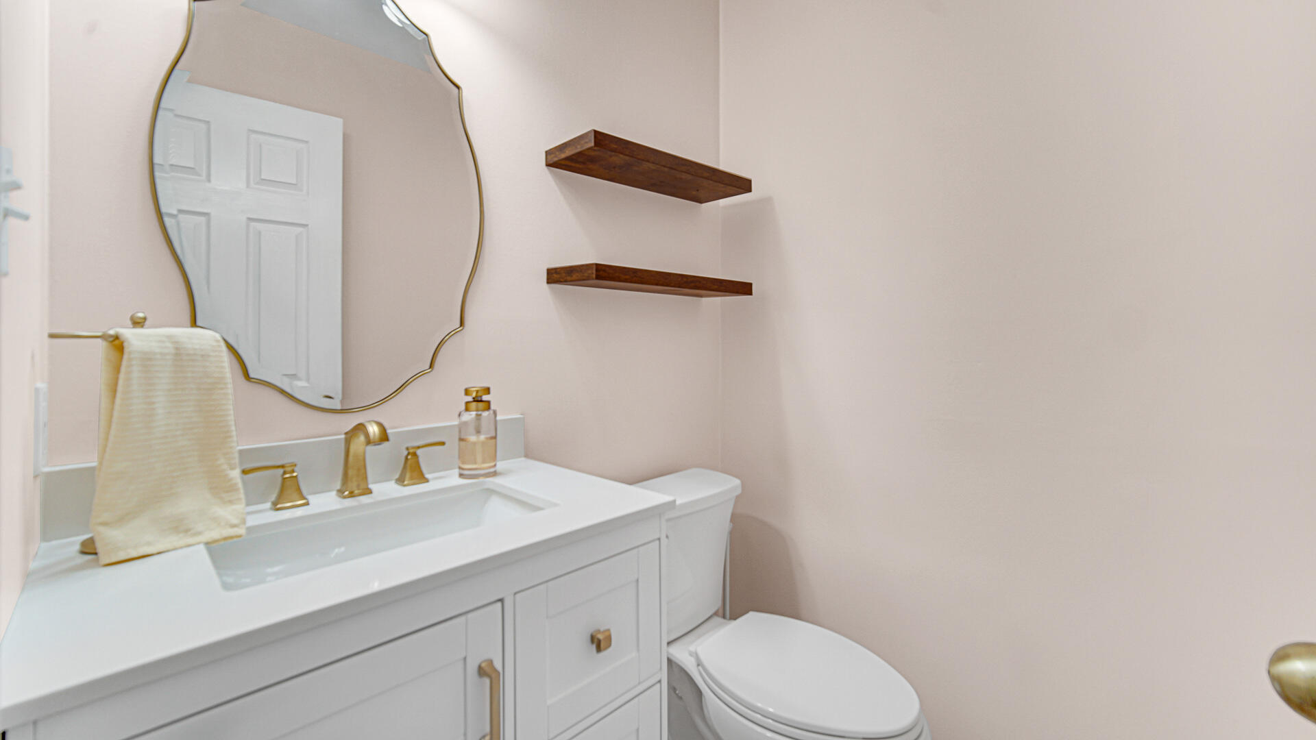 771 Kenmare Parkway Crown Point, IN 46307 - Photo 9 of 20 a bathroom with a sink vanity mirror and toilet