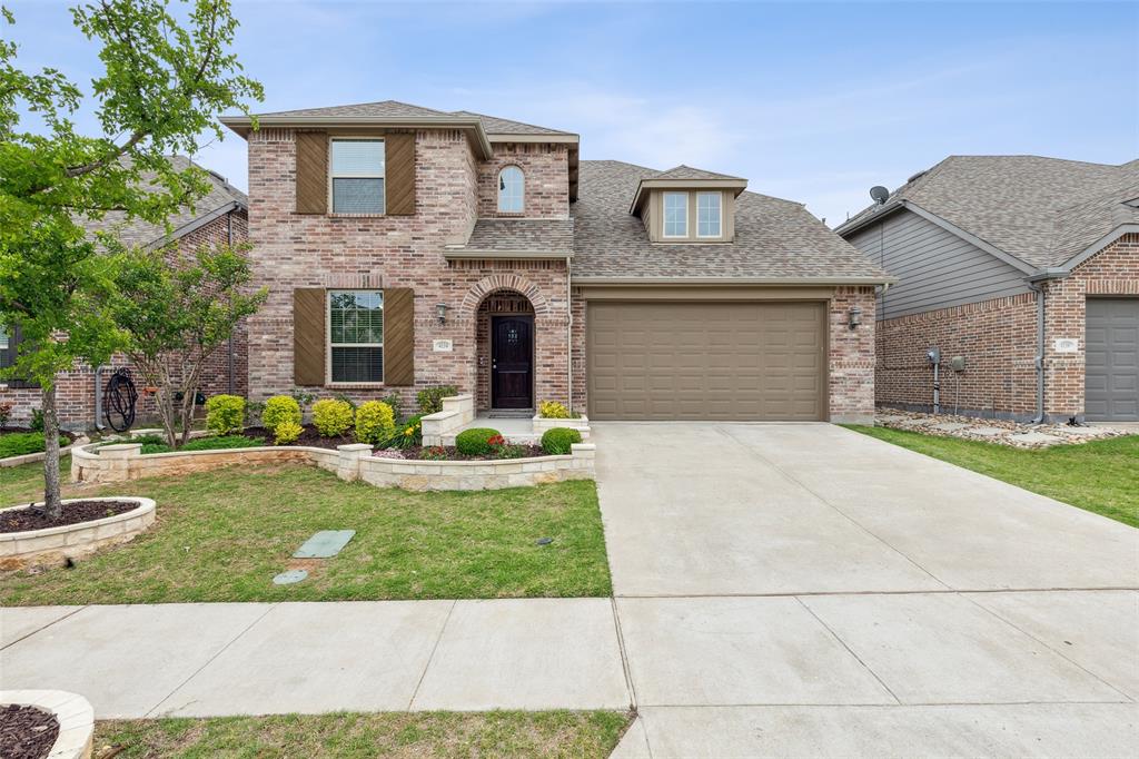 4134 Patterson Lane Celina, TX 75009 - Photo 1 of 1 a front view of a house with a yard and garage