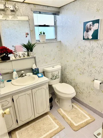 a bathroom with a toilet a sink and a bath tub