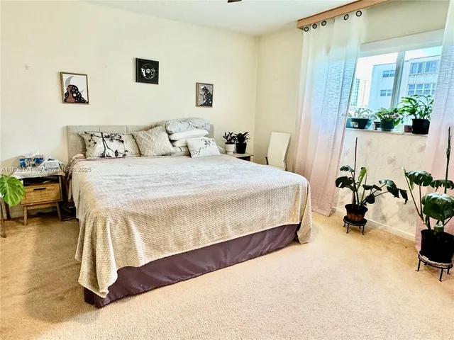 a bedroom with a bed and a table