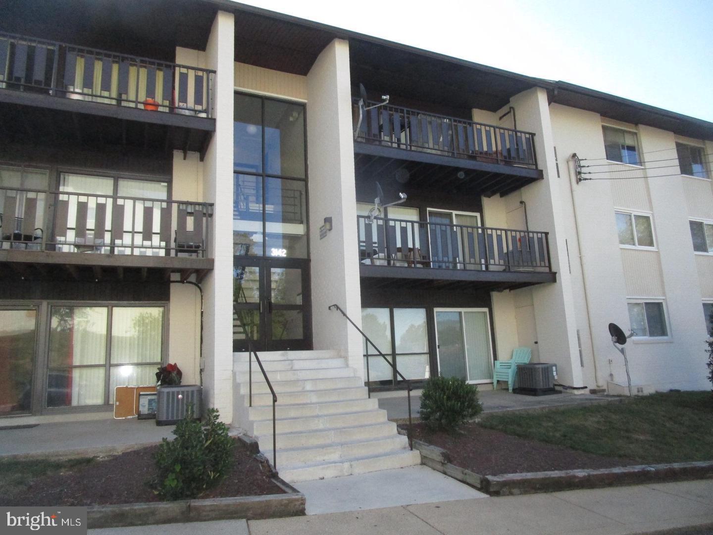 3142 Brinkley Road, Unit 6304 Temple Hills, MD 20748 - Photo 1 of 15 a view of a brick house with large windows