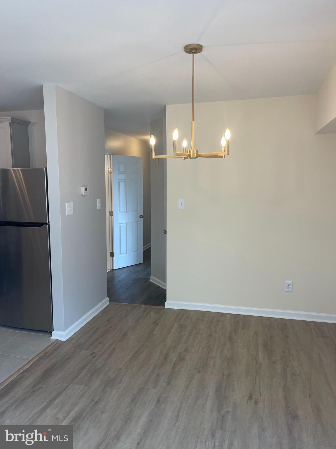 3142 Brinkley Road, Unit 6304 Temple Hills, MD 20748 - Photo 12 of 15 a view of empty room with wooden floor