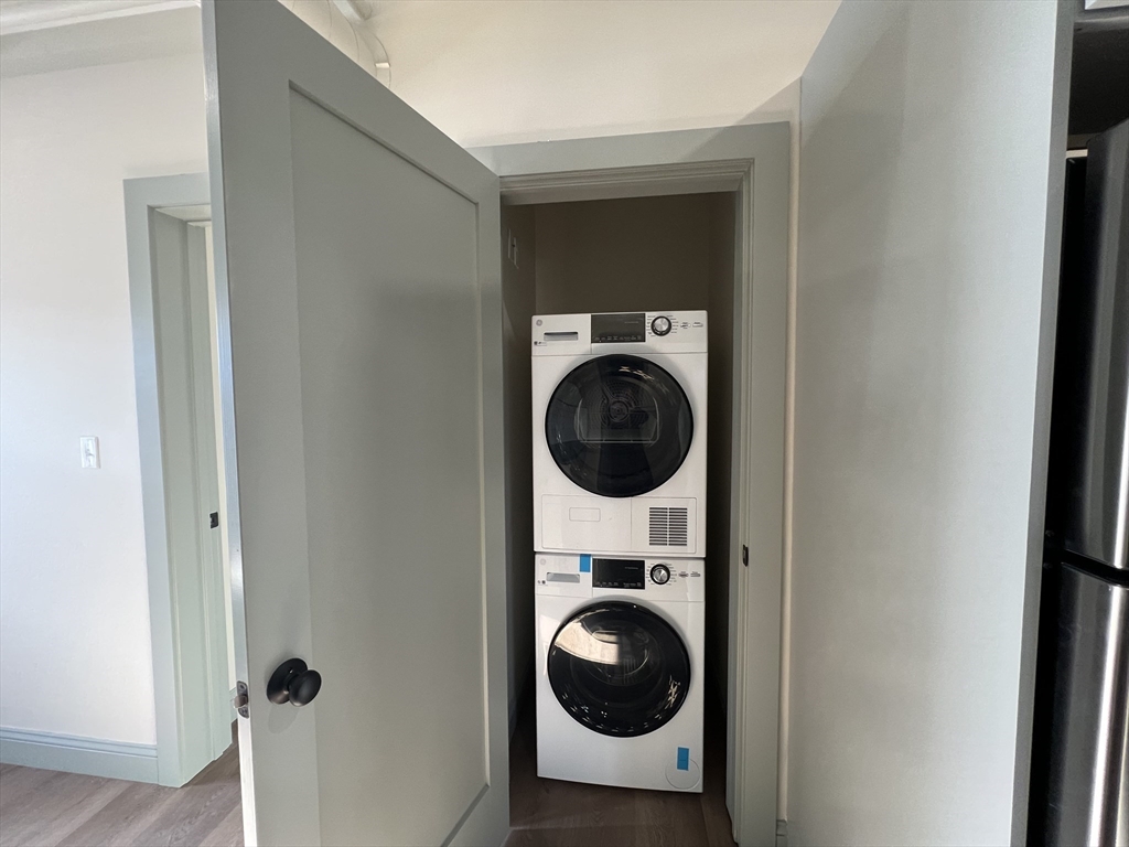 160 Seabury Street, Unit 15 Fall River, MA 02720 - Photo 4 of 10 a view of a hallway with washer and dryer