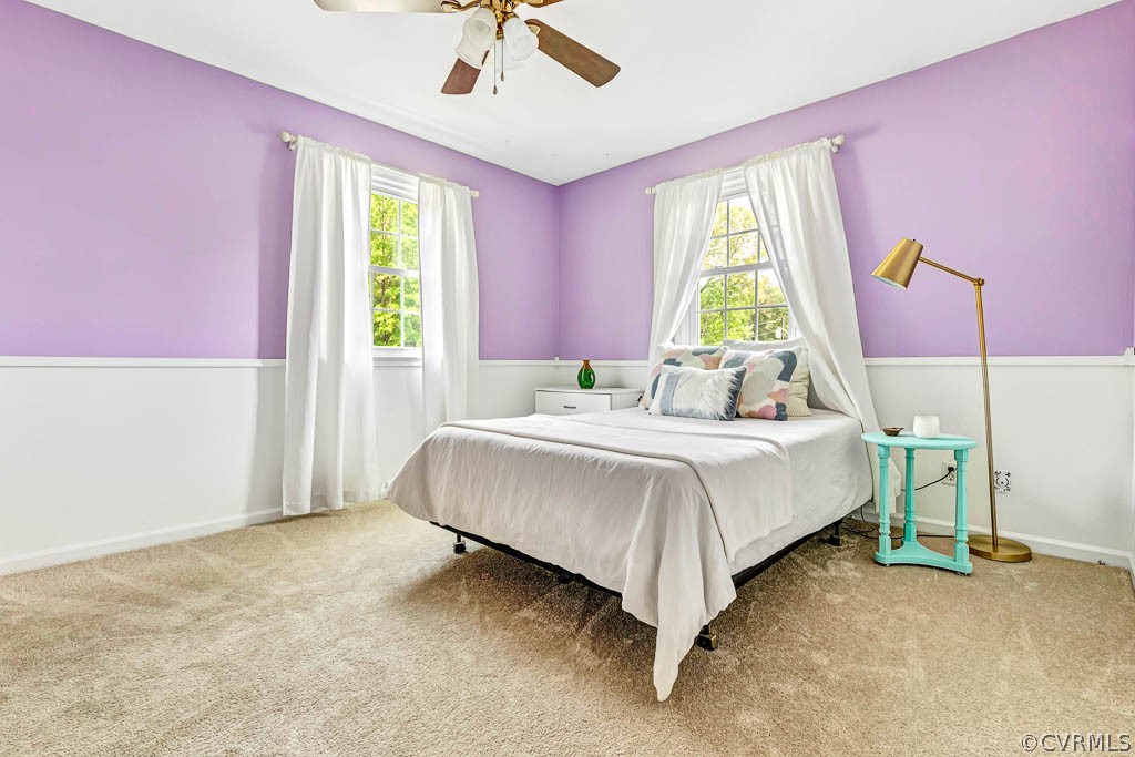 7800 Bronze Lane Prince George, VA 23875 - Photo 15 of 30 a bed room with a bed and a chandelier