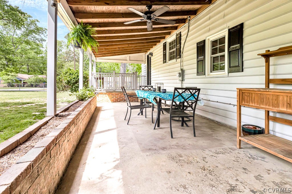 7800 Bronze Lane Prince George, VA 23875 - Photo 26 of 30 a view of a patio with a table chairs and backyard