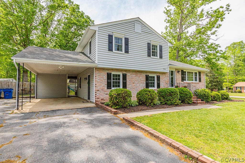 7800 Bronze Lane Prince George, VA 23875 - Photo 3 of 30 a front view of a house with yard and green space