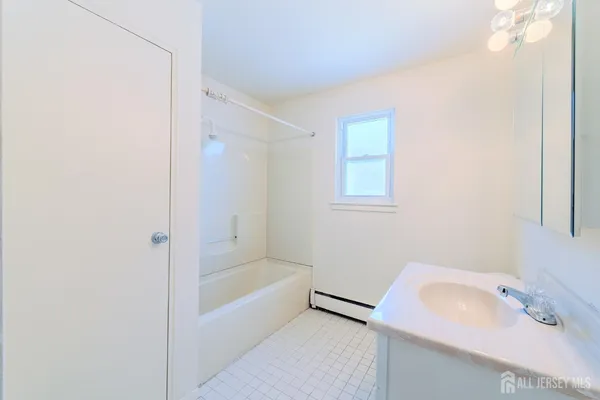 a bathroom with a sink and a bathtub