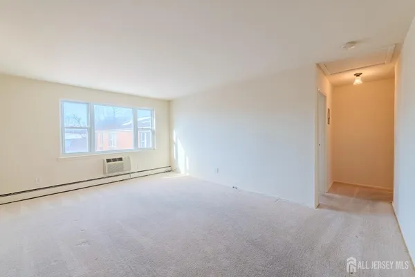 a view of an empty room with a window
