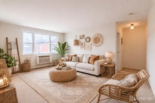a living room with furniture and a large window