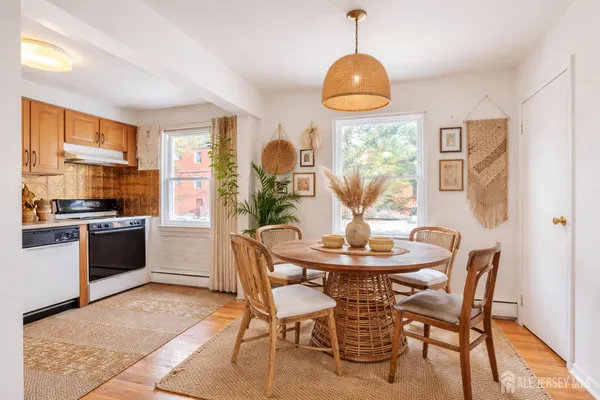 a dining room with furniture and window
