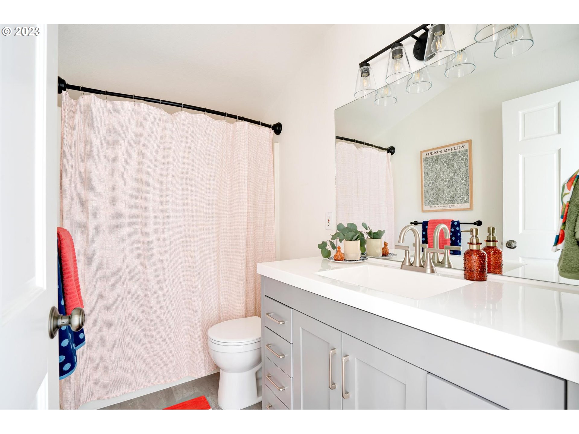 15125 Southeast Aston Loop Portland, OR 97236 - Photo 23 of 42 a bathroom with a sink and a mirror