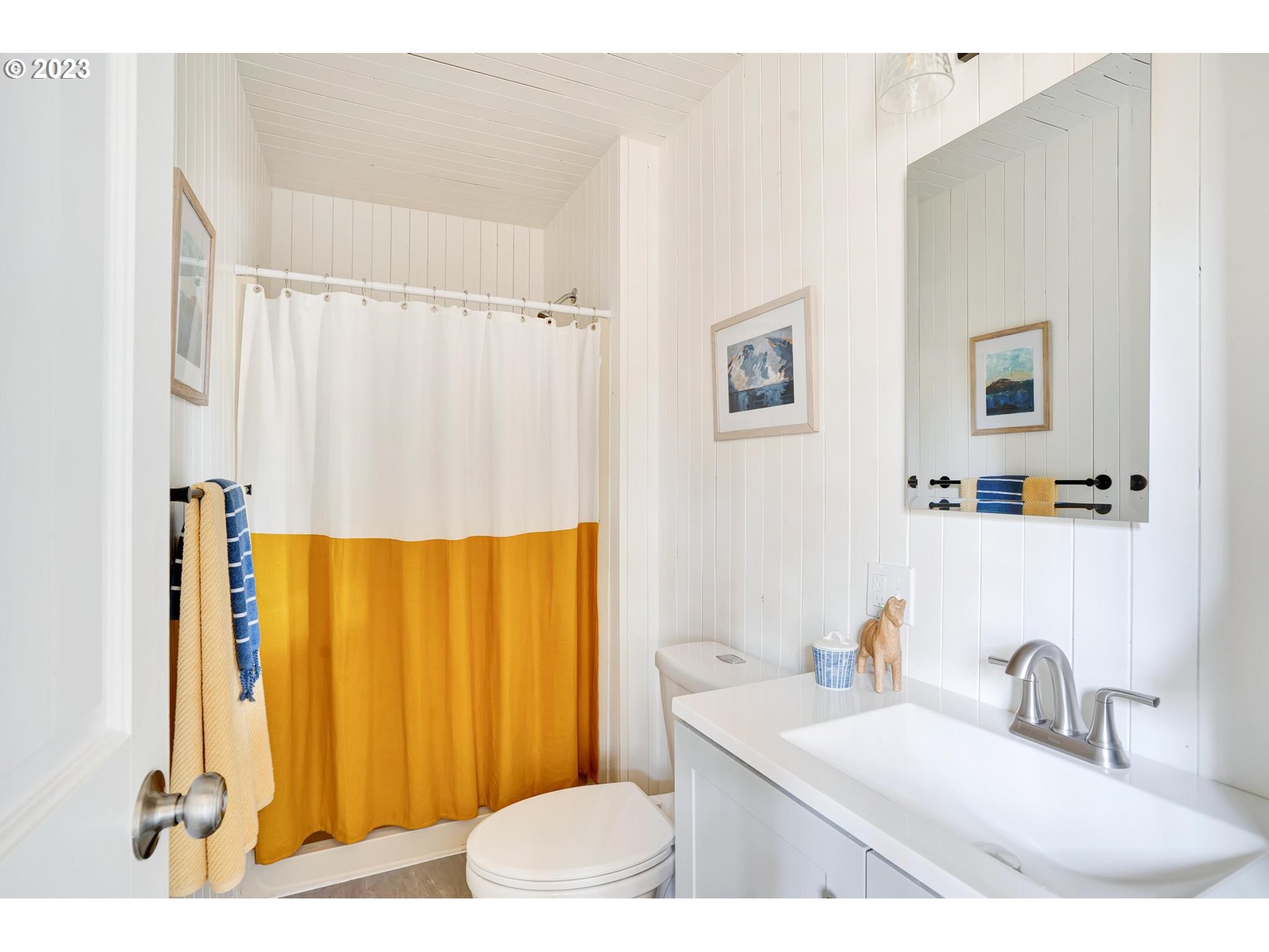 15125 Southeast Aston Loop Portland, OR 97236 - Photo 27 of 42 a bathroom with a sink a mirror and a shower curtain