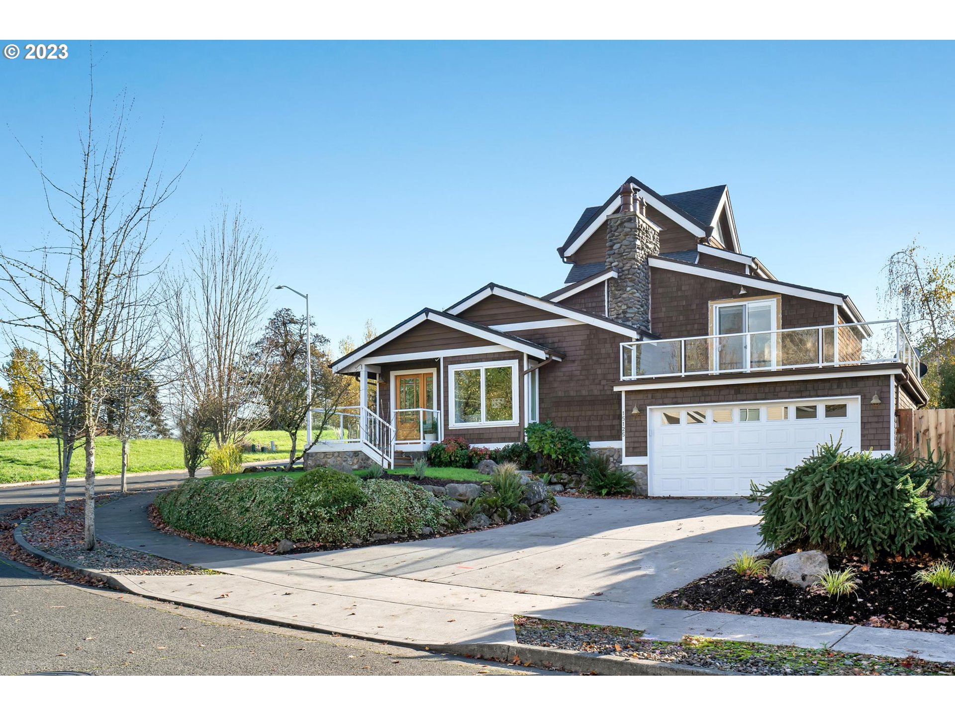 15125 Southeast Aston Loop Portland, OR 97236 - Photo 34 of 42 a front view of a house with a yard