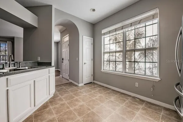 a spacious bathroom with a double vanity sink and a mirror