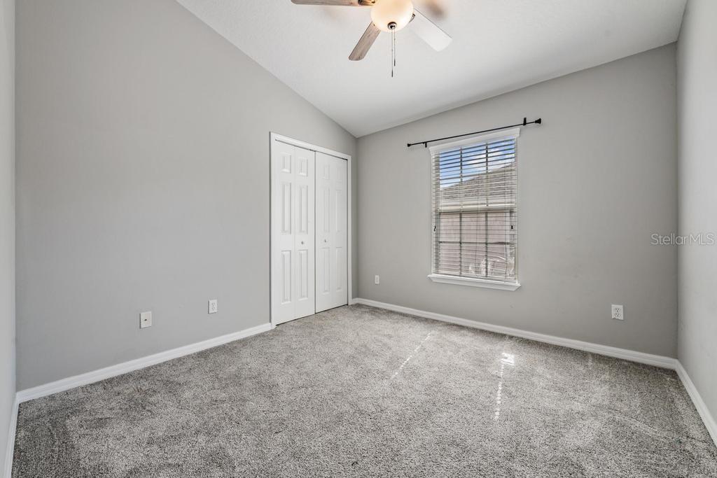 8512 Shallow Creek Court New Port Richey, FL 34653 - Photo 22 of 45 a view of an empty room with a window