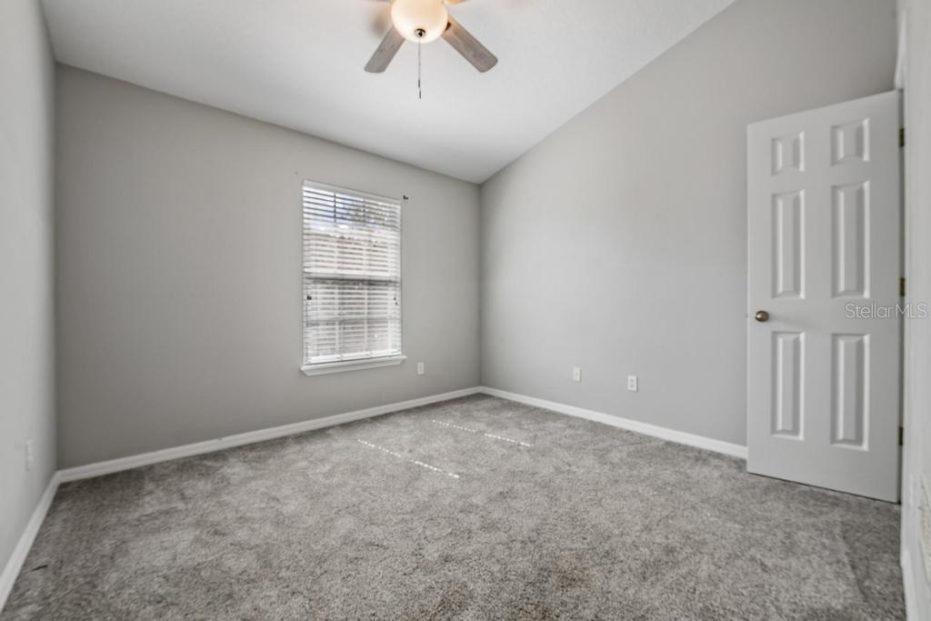 8512 Shallow Creek Court New Port Richey, FL 34653 - Photo 24 of 45 a view of an empty room with a window