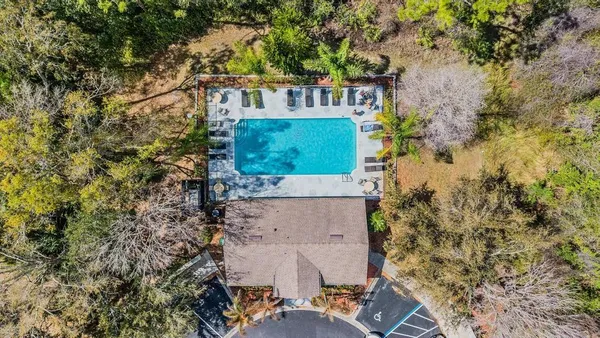an aerial view of a house with outdoor space
