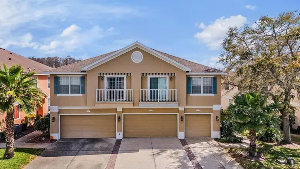 a front view of a house with a garage