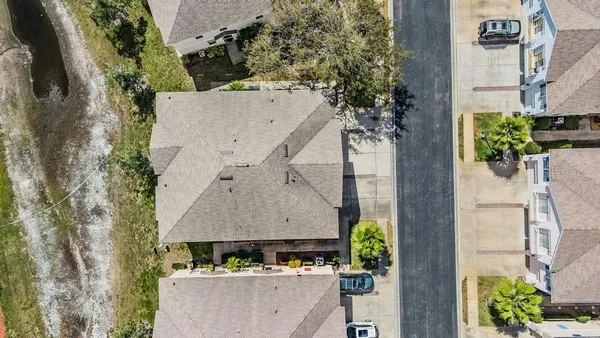 an aerial view of a house with outdoor space