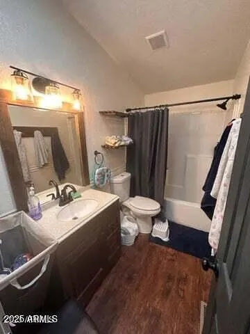 a living room with hard wood flooring