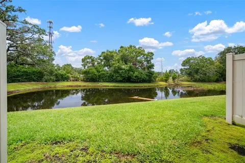a view of a lake with a yard