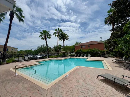 swimming pool view with a outdoor seating space