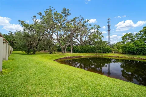 a view of a lake with a yard