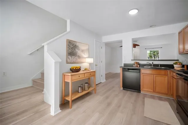 a kitchen with stainless steel appliances granite countertop a stove and a sink