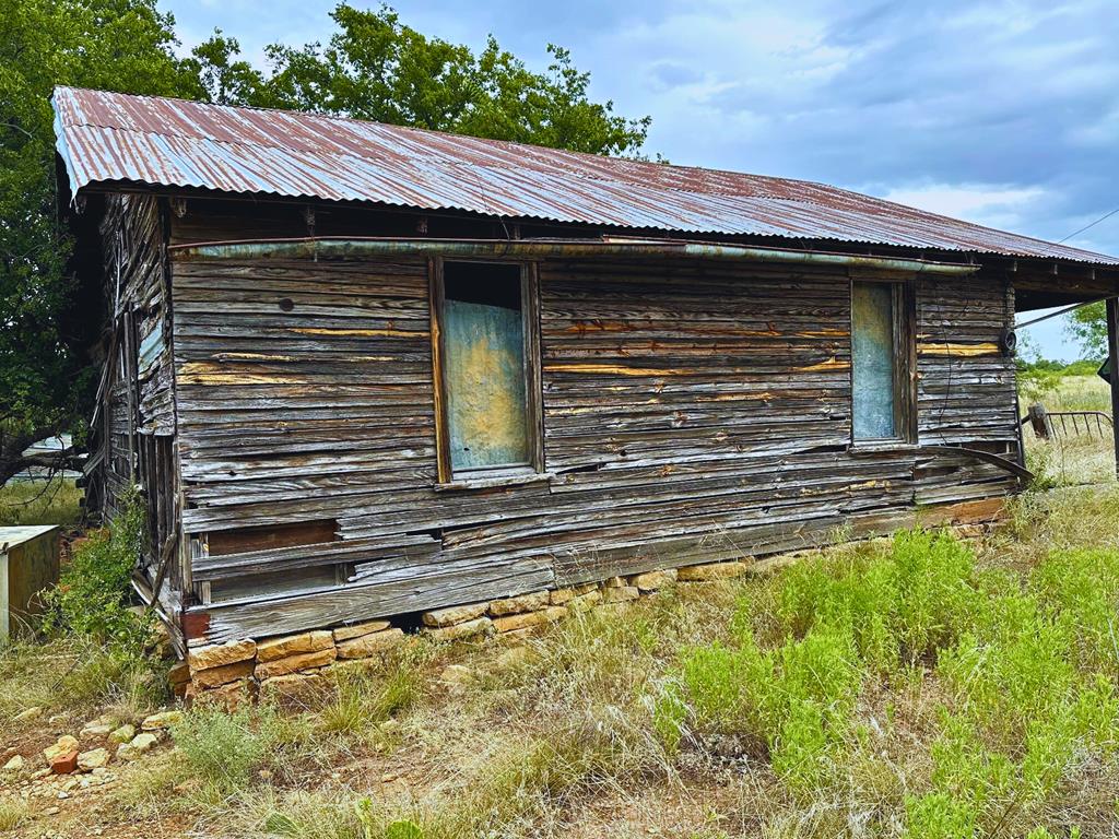 701 County Road Goldsboro, TX 79519 - Photo 15 of 17 a view of a house with a yard and stairs
