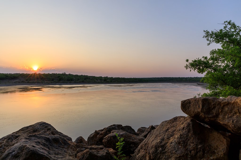 701 County Road Goldsboro, TX 79519 - Photo 3 of 17 a view of a lake with outside space