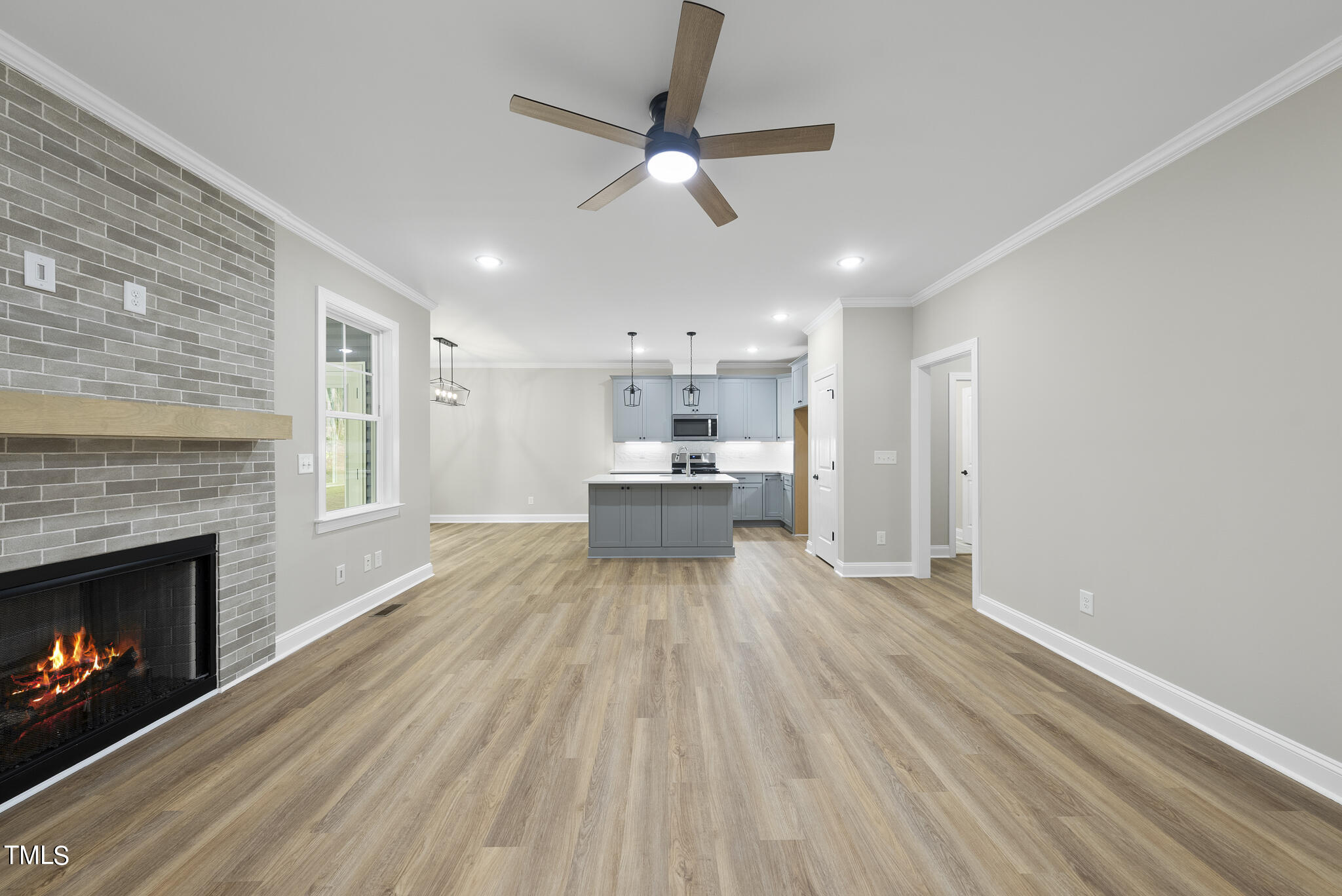 130 Pilot Ridge Road Zebulon, NC 27597 - Photo 8 of 39 a view of kitchen with livingroom and fireplace