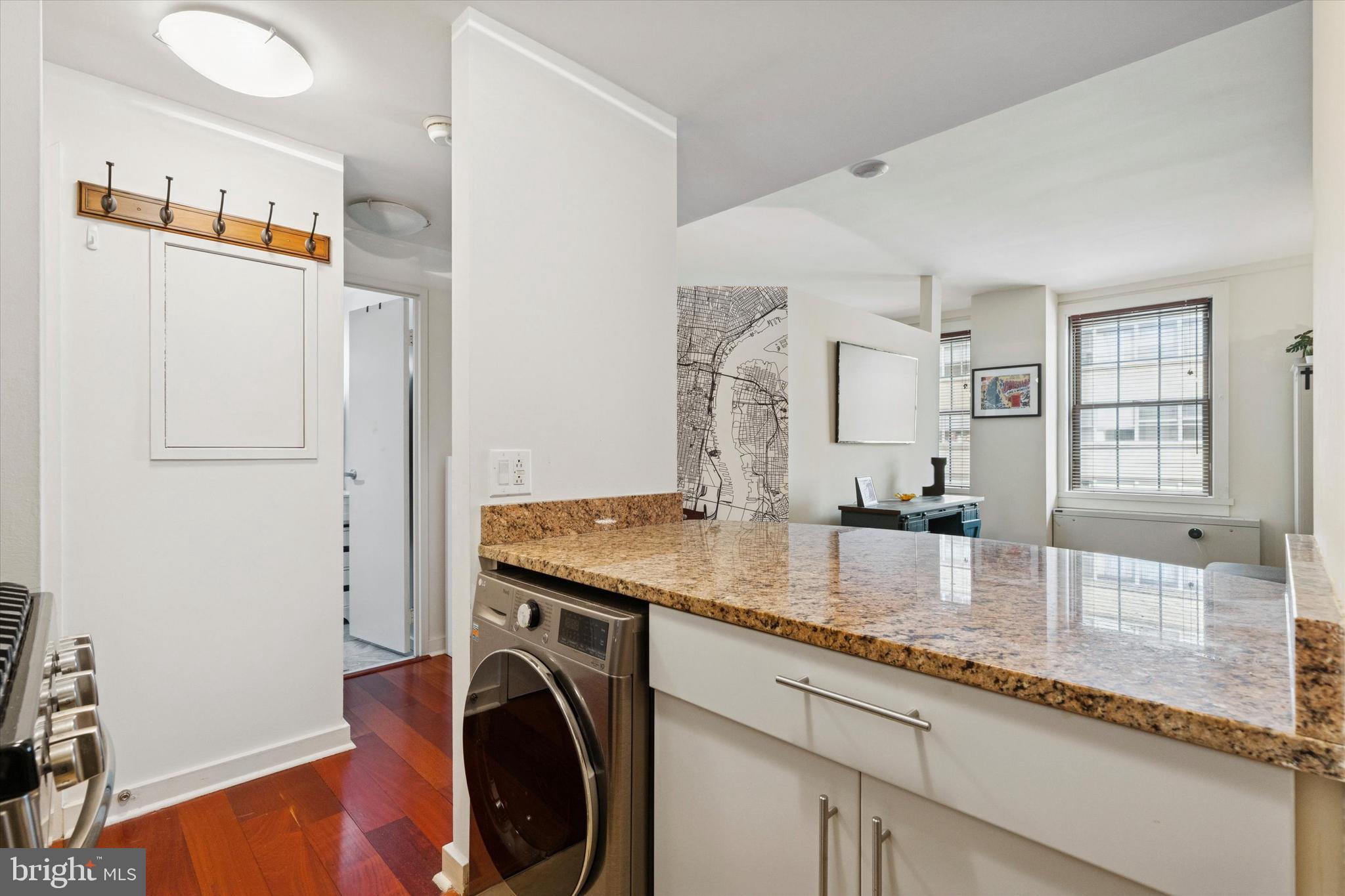 219 South 18th Street, Unit 902 Philadelphia, PA 19103 - Photo 9 of 14 a kitchen with stainless steel appliances granite countertop a sink stove and refrigerator