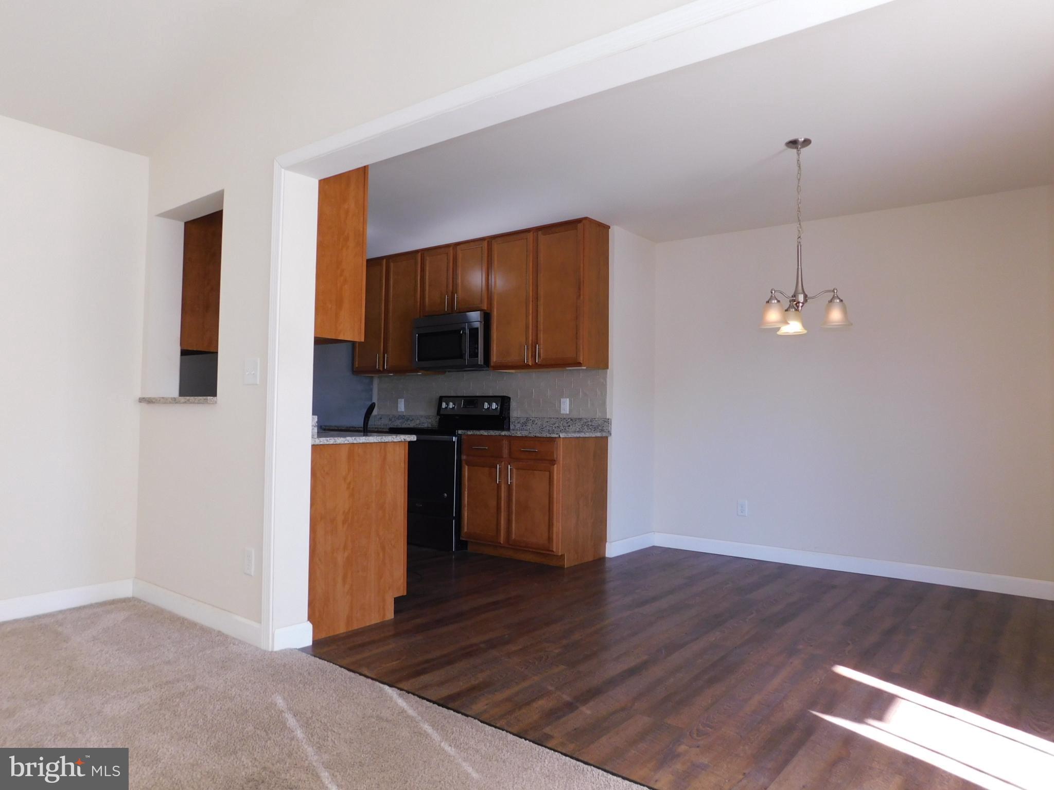 424 Eisenhower Drive Chambersburg, PA 17201 - Photo 11 of 30 a kitchen with stainless steel appliances a refrigerator and microwave