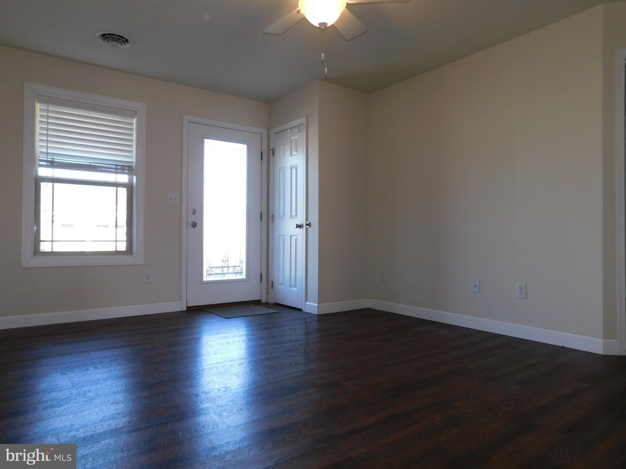 424 Eisenhower Drive Chambersburg, PA 17201 - Photo 16 of 30 an empty room with wooden floor and windows