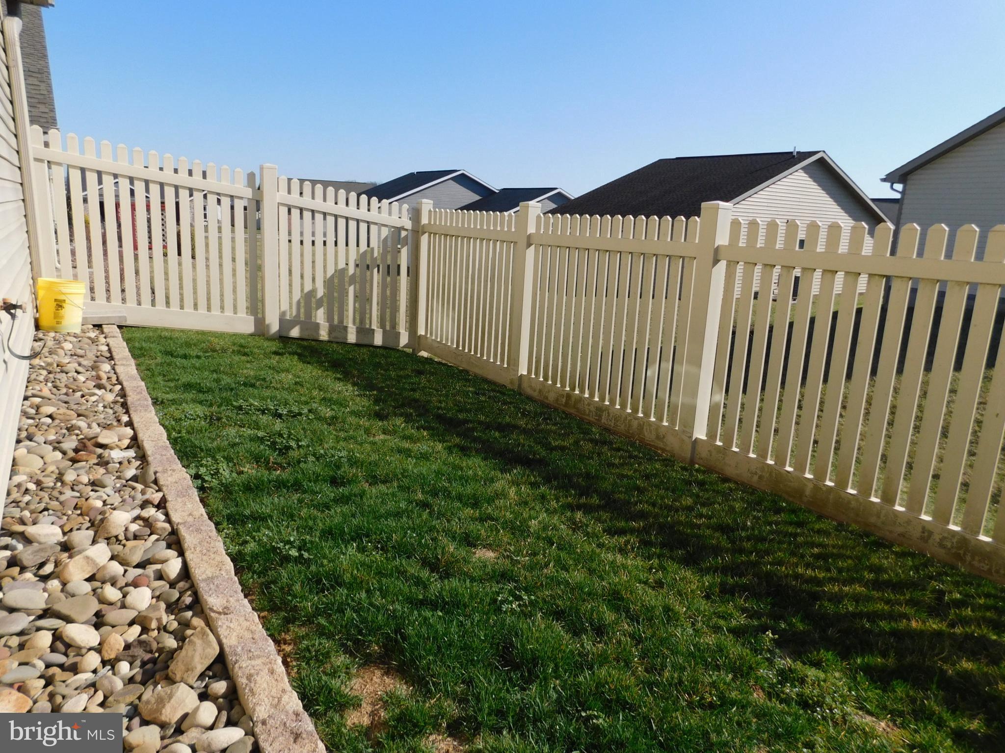 424 Eisenhower Drive Chambersburg, PA 17201 - Photo 29 of 30 a view of a house with a small yard and wooden fence