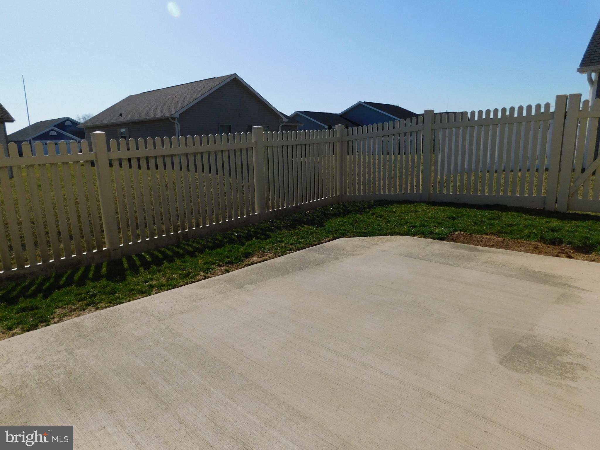 424 Eisenhower Drive Chambersburg, PA 17201 - Photo 30 of 30 a view of a green field with a wooden fence