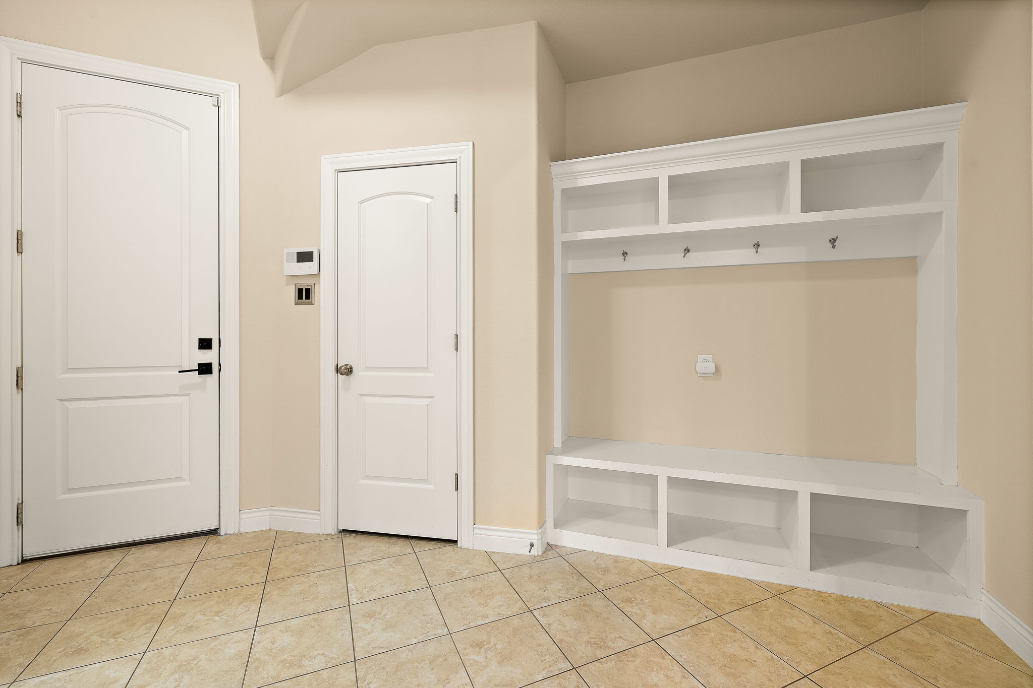 174 Estrella Crossing Georgetown, TX 78628 - Photo 30 of 38 Mudroom with light tile patterned floors