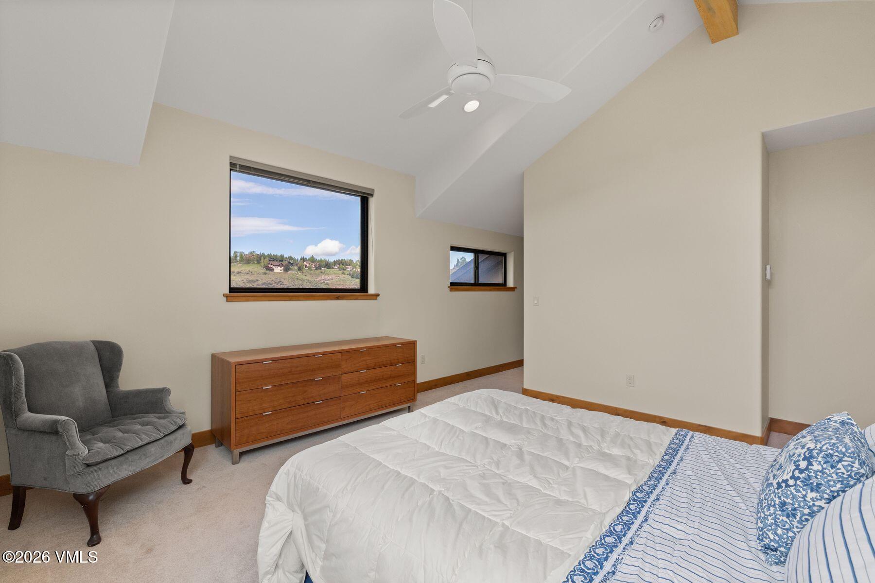 1015 West Wildwood Road, Unit F Avon, CO 81620 - Photo 20 of 35 a bedroom with a bed and a couch