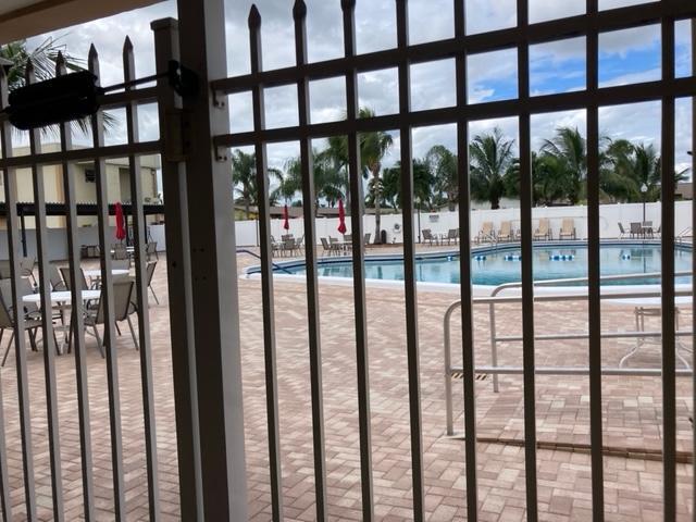 2894 East Crosley Drive, Unit J West Palm Beach, FL 33415 - Photo 7 of 11 a view of staircase with a large window
