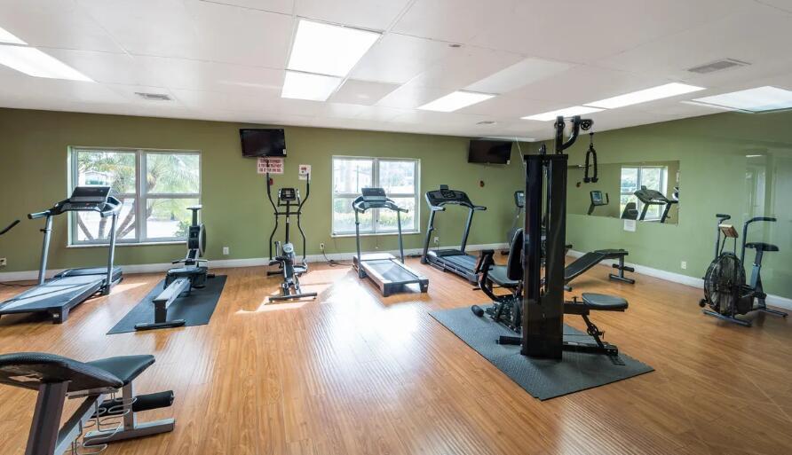 2894 East Crosley Drive, Unit J West Palm Beach, FL 33415 - Photo 8 of 11 a view of a room with gym equipment