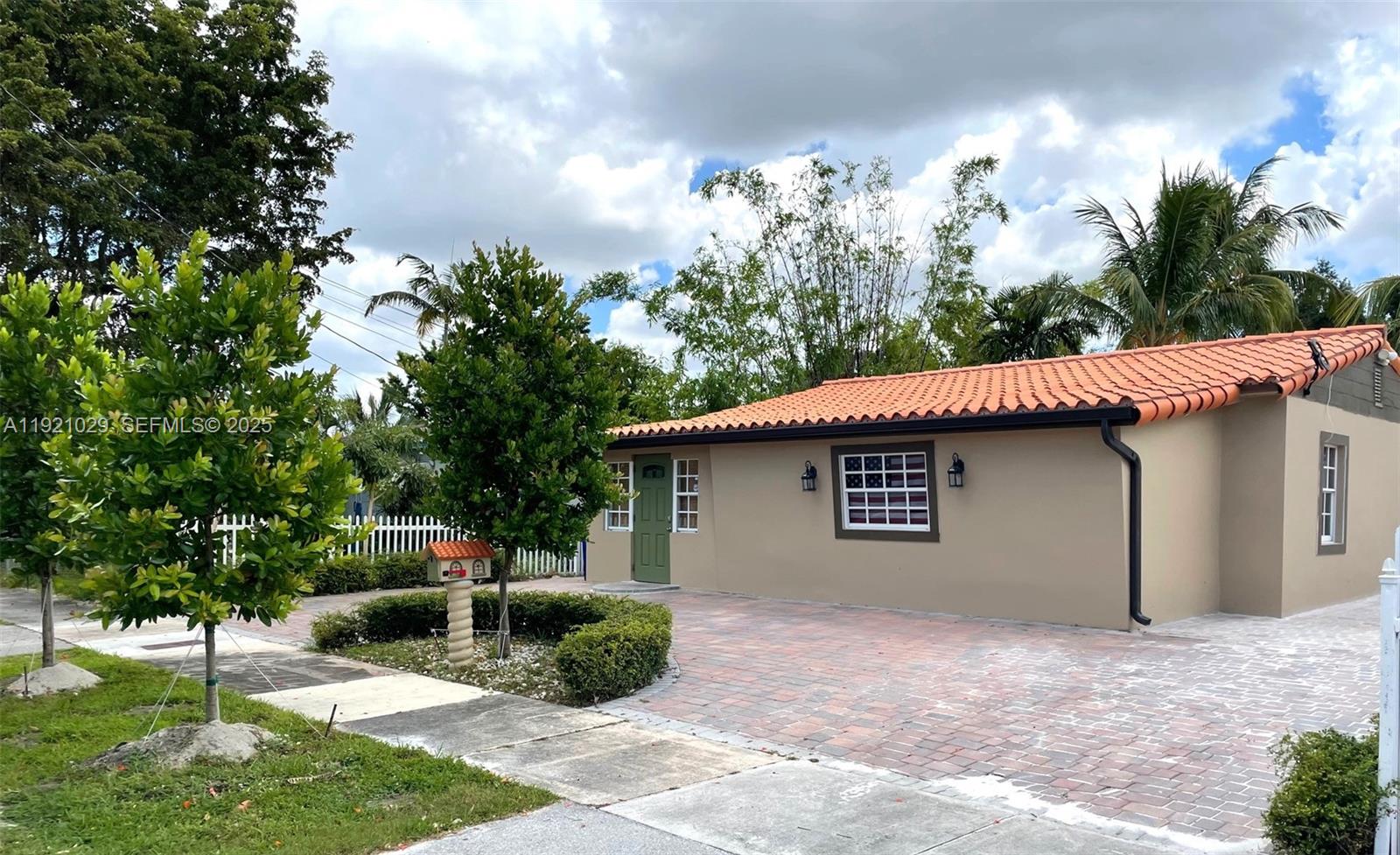 635 Southwest 64th Court Miami, FL 33144 - Photo 12 of 33 a house with trees in the background