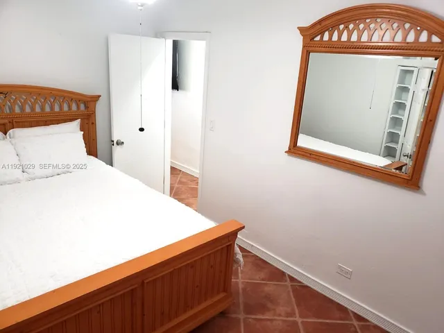 a view of a room with rack and wooden floor