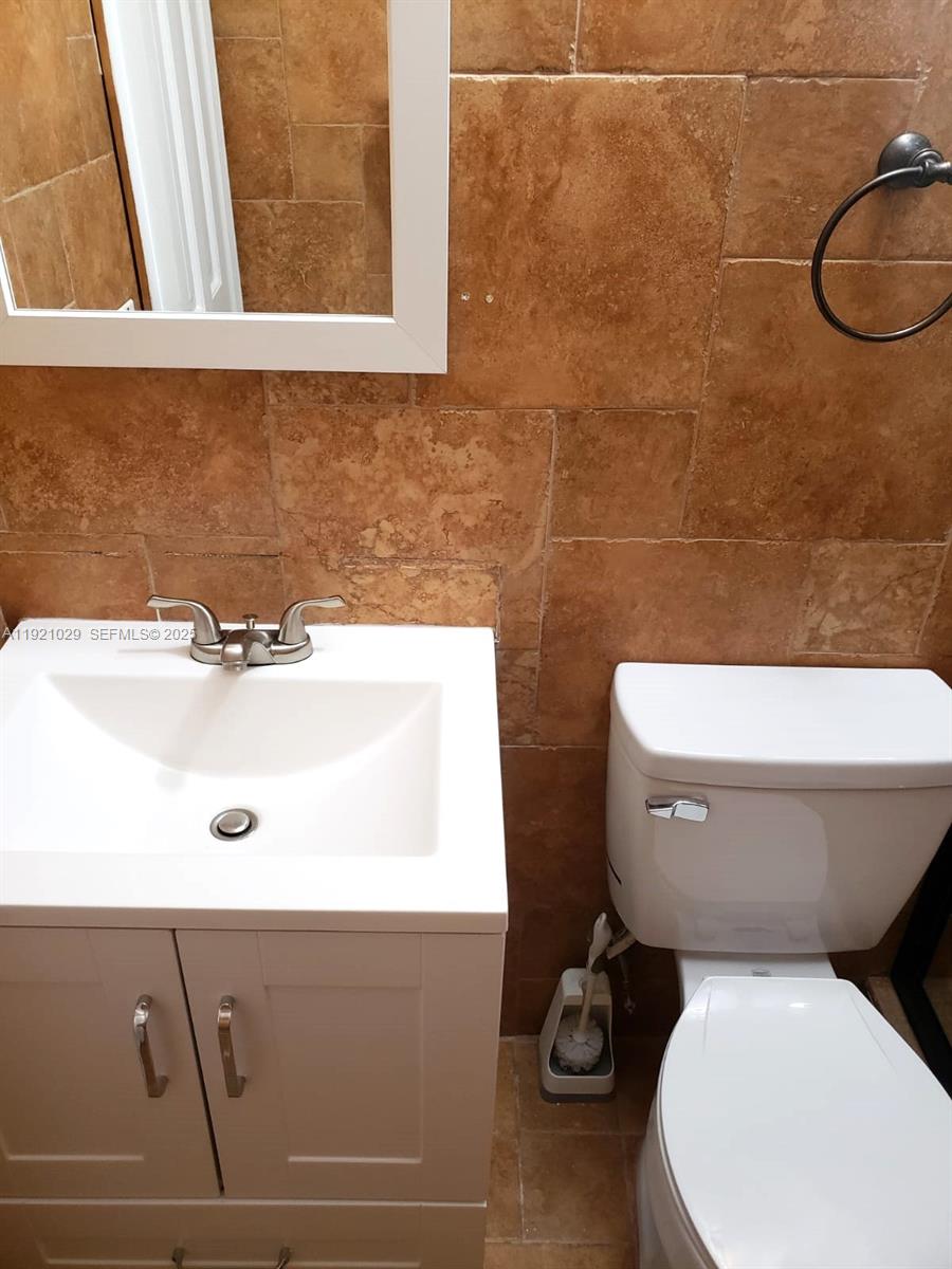 635 Southwest 64th Court Miami, FL 33144 - Photo 23 of 33 a bathroom with a toilet and a sink