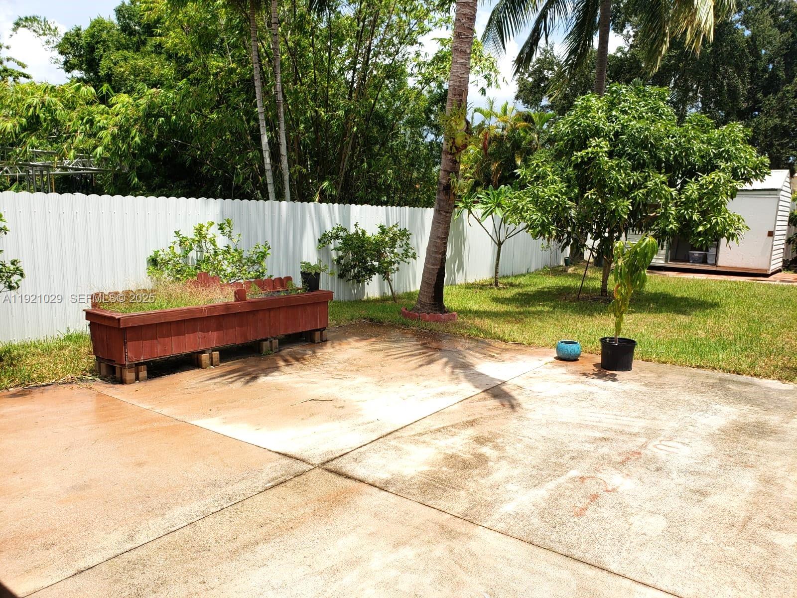 635 Southwest 64th Court Miami, FL 33144 - Photo 29 of 33 a view of a garden with potted plants