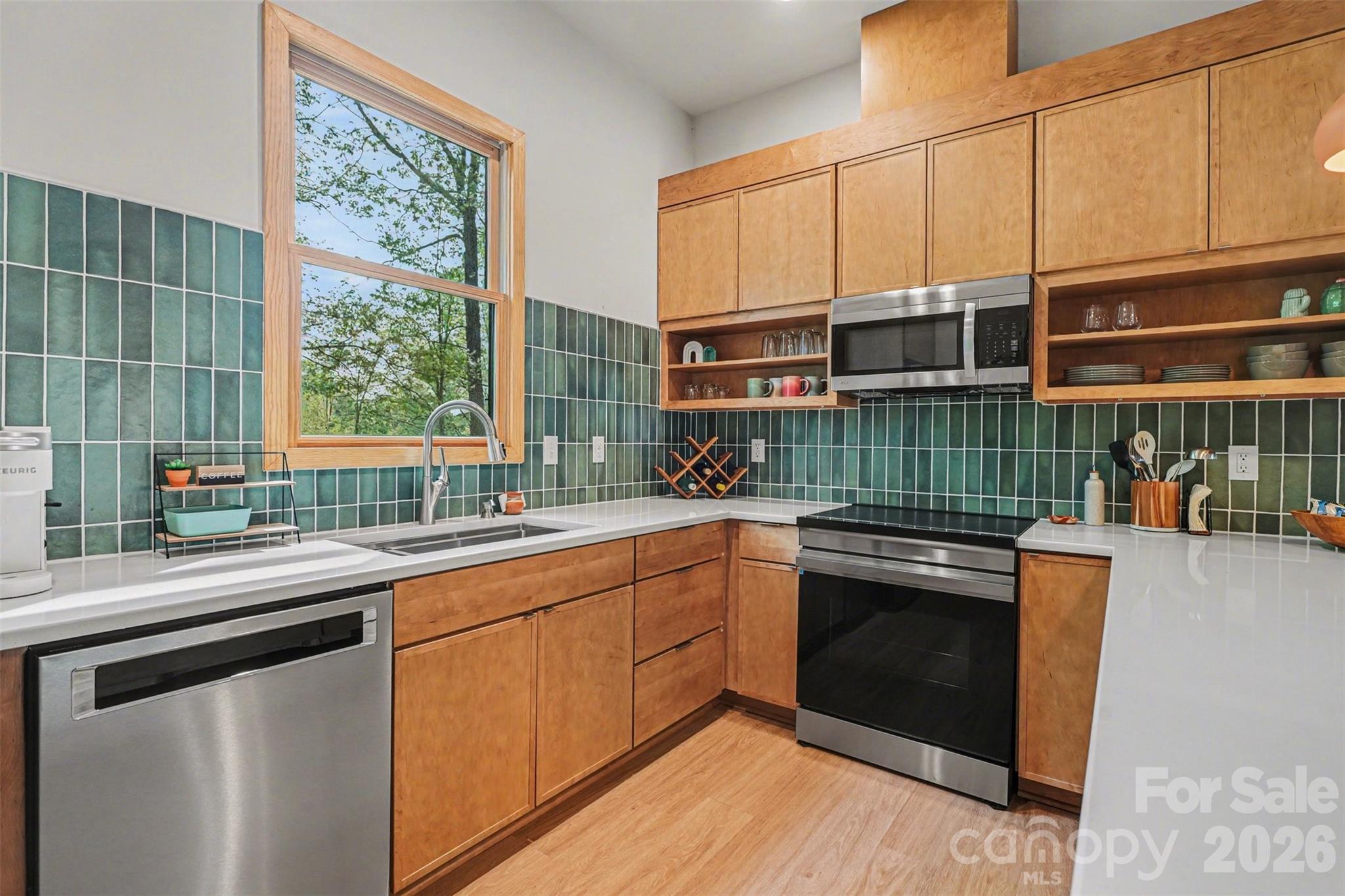 12141 Coyle Road, Unit 12 Stanfield, NC 28163 - Photo 12 of 28 a kitchen with a sink stove and cabinets
