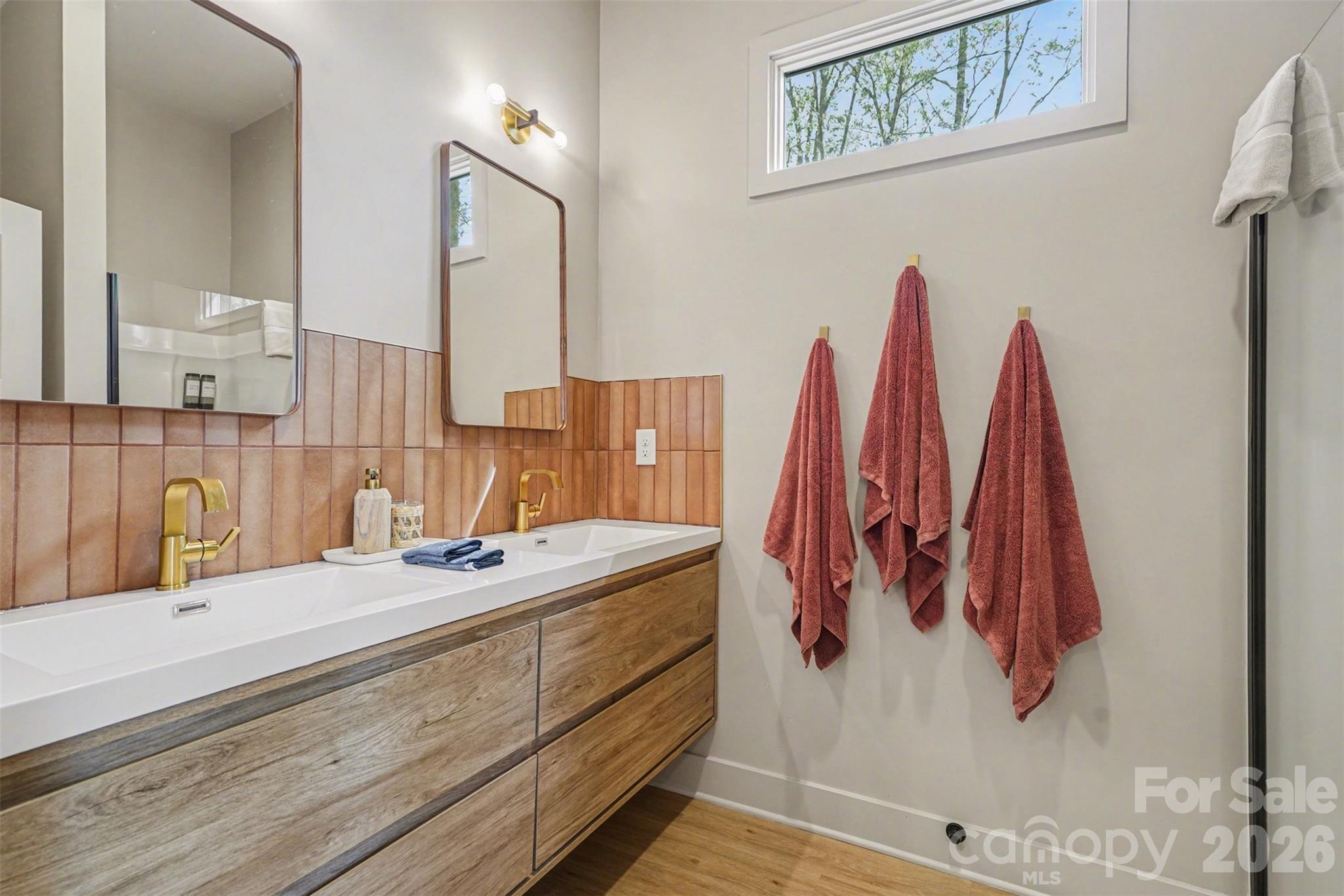 12141 Coyle Road, Unit 12 Stanfield, NC 28163 - Photo 23 of 28 a bathroom with a sink vanity and mirror
