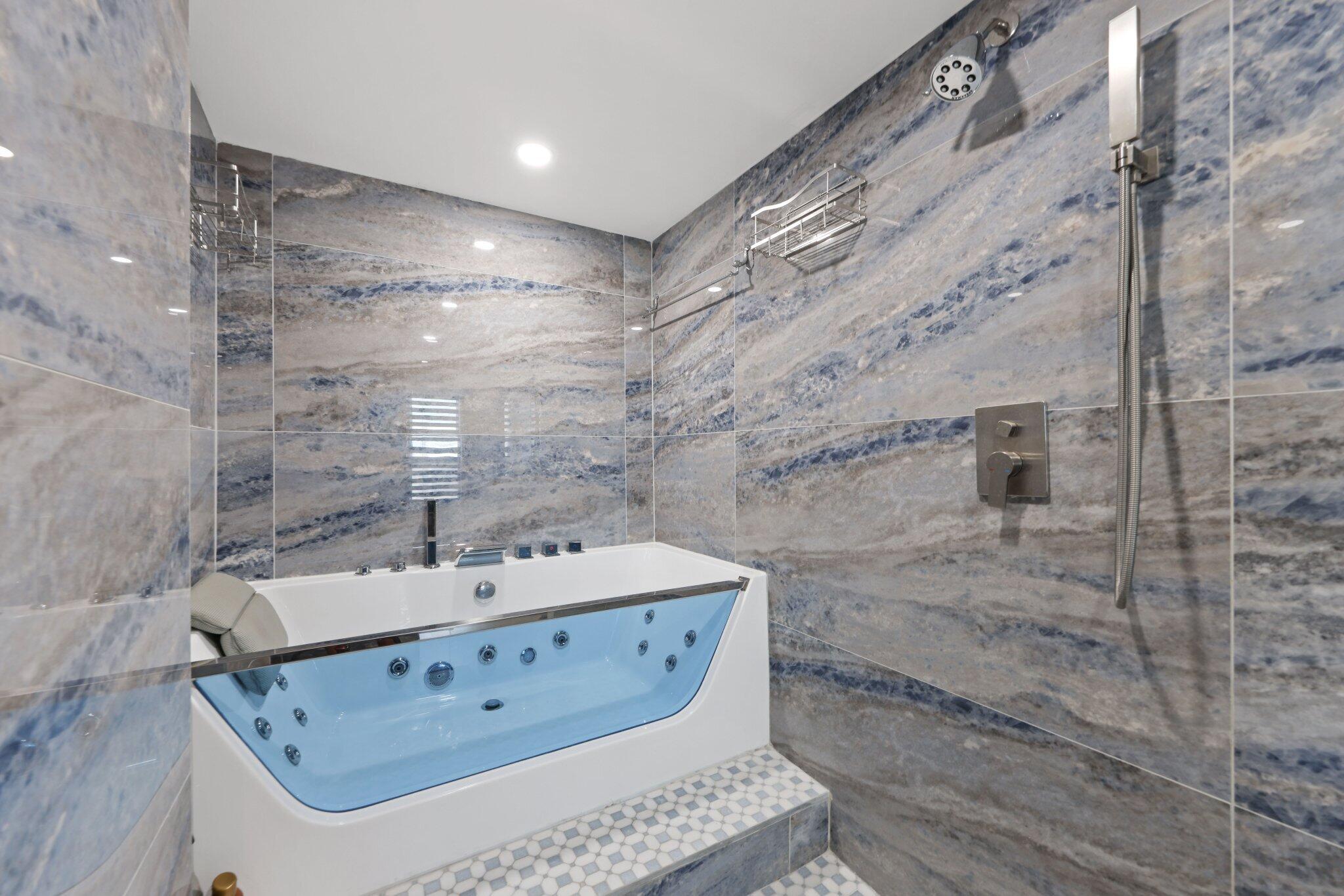 12 Royal Palm Way, Unit 605 Boca Raton, FL 33432 - Photo 26 of 47 a bathroom with a bathtub and a sink